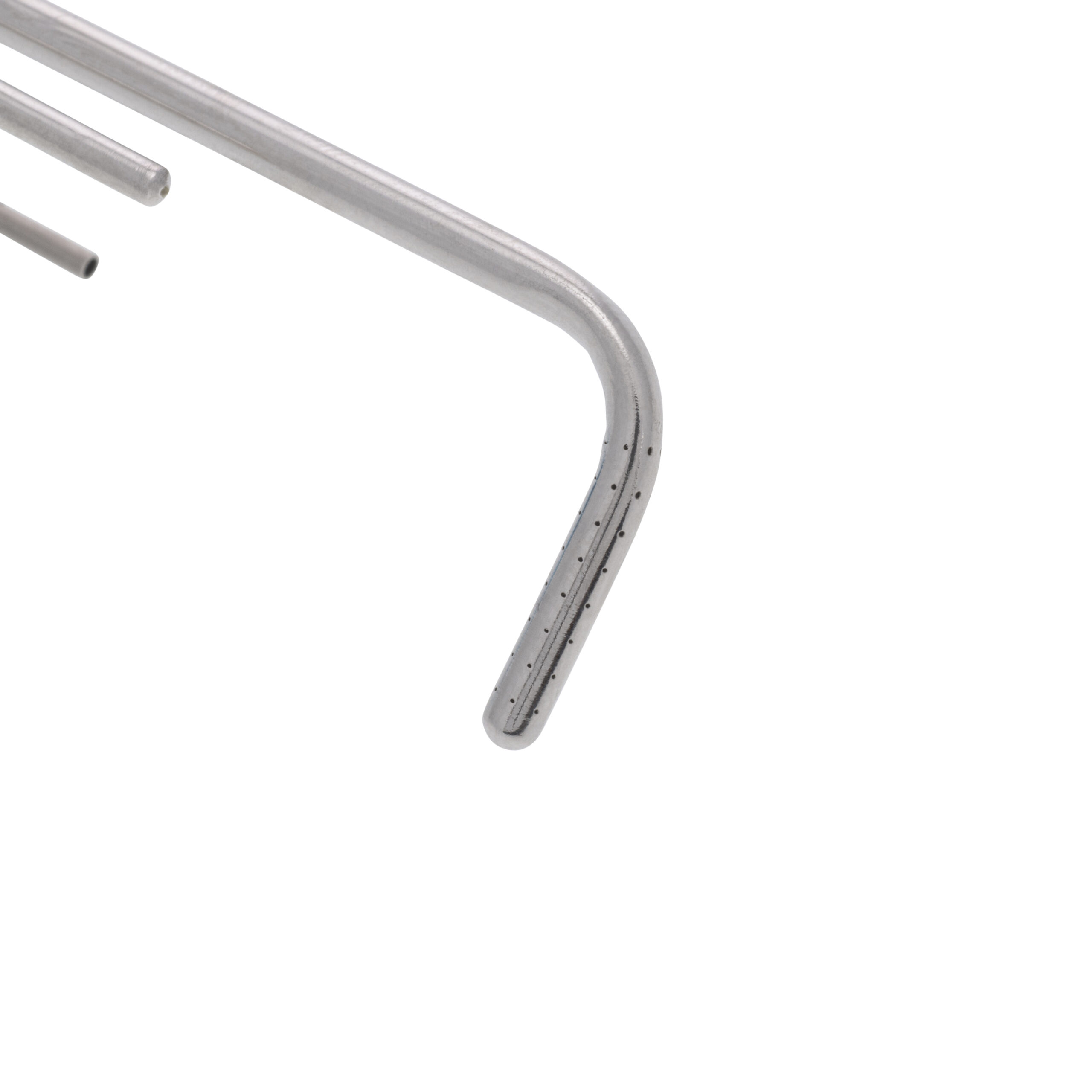 Close-up of the end of a sparging needle showing the array of holes.